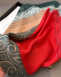Detail of paisley patterns and herringbone weave on red green pashmina shawl