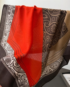 Detail of red and brown paisley scarf showing breathable herringbone linen texture