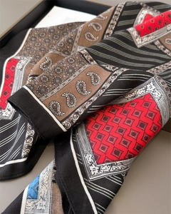 Detail of vintage paisley and geometric pattern cotton-linen scarf with fine edge stitching