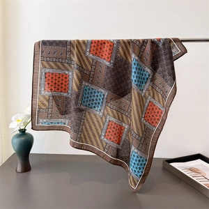 Vintage paisley and herringbone cotton-linen feel square scarf draped on metal stand