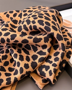 Detail of leopard print scarf showing the herringbone weave texture and soft fabric