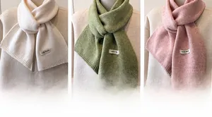 Detail of wool blend knitted scarves showing premium texture and quality labels