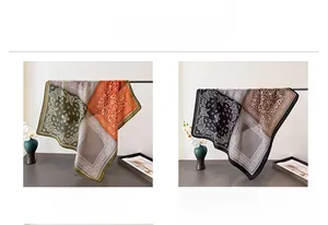 Detail view of paisley scarves in green and black borders with vintage texture