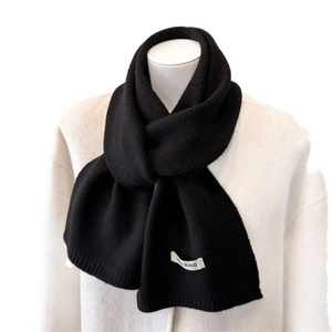 Thick black wool blend knit scarf with ribbed texture for winter warmth and comfort