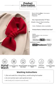Detail of red knit cross scarf showing material specs and care guide labels