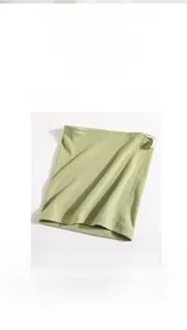 Detail view of light green fleece neck gaiter with adjustable white drawstring and toggle