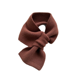 Solid color warm knitted crossover scarf in dark caramel brown for women's winter wear