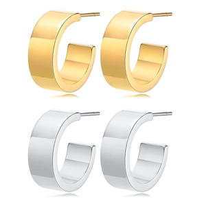 Macro view of C-shaped hoop earrings in polished gold and silver finishes