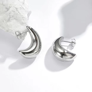 Minimalist thick silver crescent moon drop earrings with a high-polished mirror finish