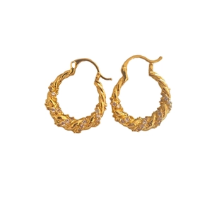 Elegant gold twisted rope hoop earrings featuring sparkling inlaid zircon stones for women