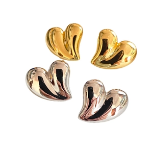 Polished 18K gold and silver plated chunky heart stud earrings set in a 3D puff design