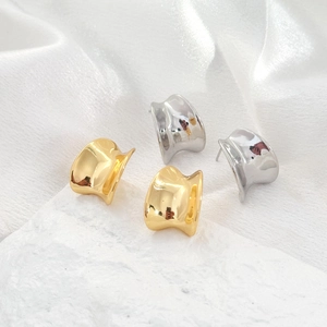 Minimalist geometric gold and silver stud earrings with high-polished mirror finish