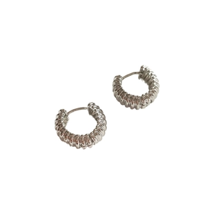Silver twisted hoop earrings with textured spiral design on a clean white background