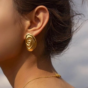18K gold plated spiral earring with liquid metal texture and irregular swirl design