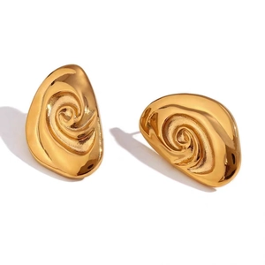 Detailed view of irregular 18K gold plated spiral earrings with textured wave design