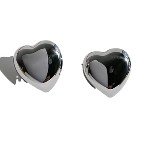 Minimalist silver heart-shaped stud earrings with polished mirror finish for women
