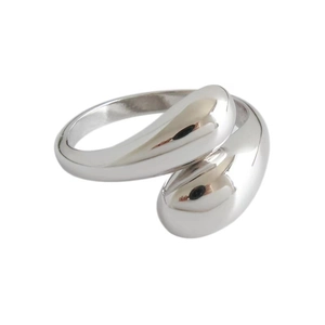 Macro shot of silver teardrop open ring with high-polish mirror finish detail
