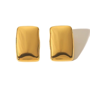 Golden rectangular metal earrings with irregular textured surface and liquid metal finish