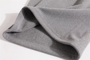 Close-up of gray fleece lining and knit texture on this warm winter neck warmer