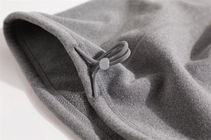 Macro shot of grey fleece neck warmer featuring adjustable drawstring and plastic toggle