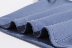 Detail of navy blue thermal fleece fabric showing breathable texture and double stitching