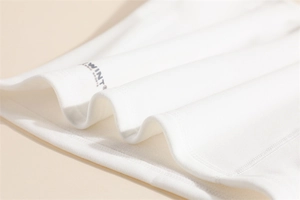 Detail of white fleece neck warmer fabric showing WINT CLASSIC SPORTS print text