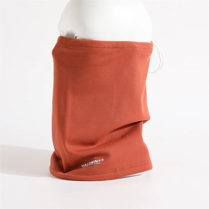 Close-up of burnt orange fleece neck gaiter with ear loops and sports logo detail