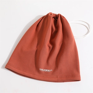 Close-up of brick red fleece neck warmer featuring white drawstring and brand logo
