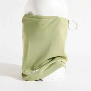 Close-up of light green fleece neck warmer with adjustable drawstring and sports logo