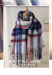 Detailed view of the soft plaid cashmere-like scarf texture with long fringe tassels