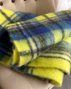 Macro shot of fluffy rainbow mohair plaid scarf with thick brushed texture detail