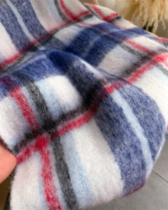 Close-up of rainbow mohair plaid scarf showing soft brushed texture and colorful fringe