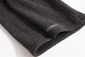 Detail of grey ribbed knit neck gaiter featuring the Halowint outdoor sports logo print