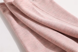 Close-up of pink and white striped knit fabric showing soft texture and elasticity