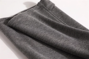 Detail of dark grey ribbed knit fabric showing soft texture and premium thermal material