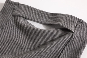 Detail of gray ribbed knit neck warmer with soft white fleece lining for winter
