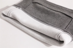 Detail of grey ribbed knit scarf with warm white fleece lining for winter cycling