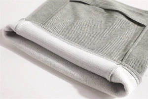 Detail of grey striped knit neck gaiter with thick white fleece lining for warmth