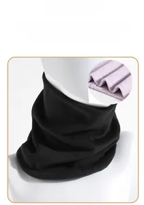 Detail of black winter neck warmer featuring a soft purple plush lining for thermal insulation