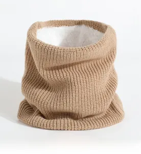 Detail of camel knit neck warmer with thick white faux fur lining for winter warmth