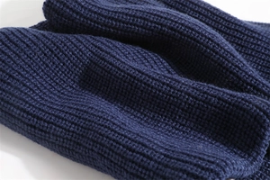 Close-up of dark blue ribbed knit fabric texture on a thick winter neck warmer