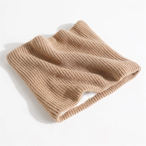 Close-up of khaki ribbed knit neck warmer with thick white faux fleece lining texture