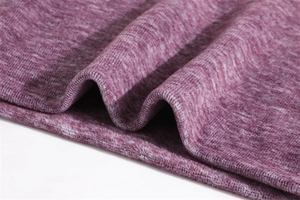 Macro detail of purple marl knitted fabric texture with soft thick waves and cozy fibers
