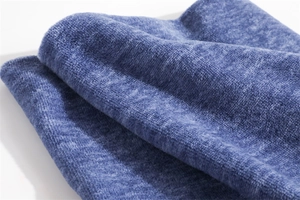 Detailed close-up of dark blue soft fleece fabric texture on winter neck warmer