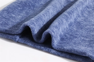 Close-up of thick blue fleece neck warmer showing soft texture and reinforced stitching