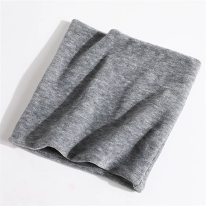Detailed close-up of mid-gray knitted neck warmer showing fine texture and soft fabric