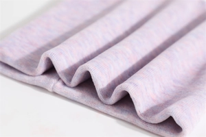 Detail of light purple knit fabric showing soft texture and cozy double-layer warmth