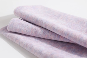 Macro shot of double-layer knitted neck warmer with soft pastel mixed color texture