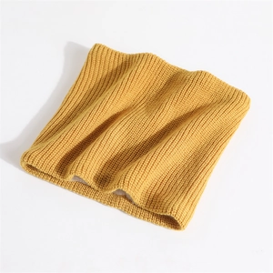 Detailed view of yellow ribbed knit texture and soft elastic fabric of the neck warmer