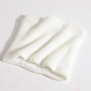 Detailed view of the soft white knitted neck warmer showing thick fleece lining and texture